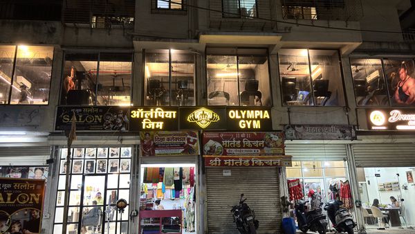 Olympia Gym Raunak City: Olympia Gym signboard at night