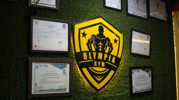 Olympia Gym Ulhasnagar: certified trainers wall
